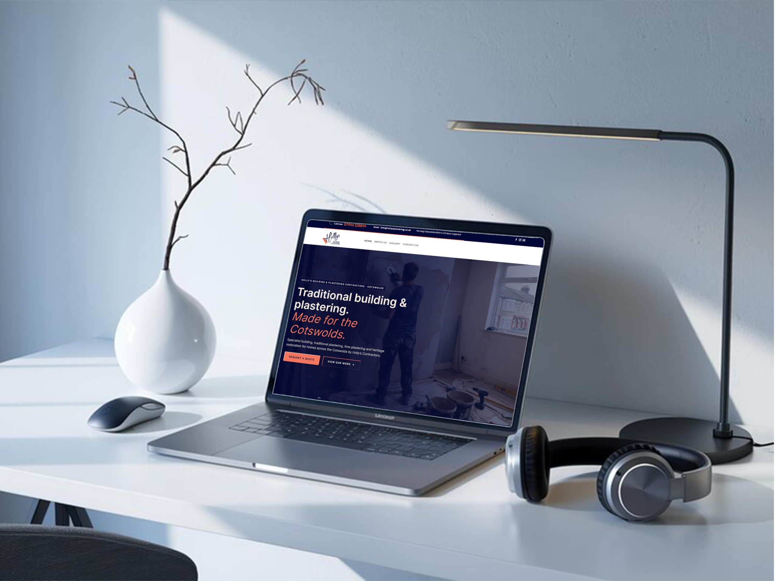 Holly's Building and Plastering website on a laptop